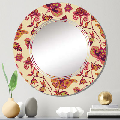 Miroir mural rond rouge à motif de fleurs rouges sur fond beige