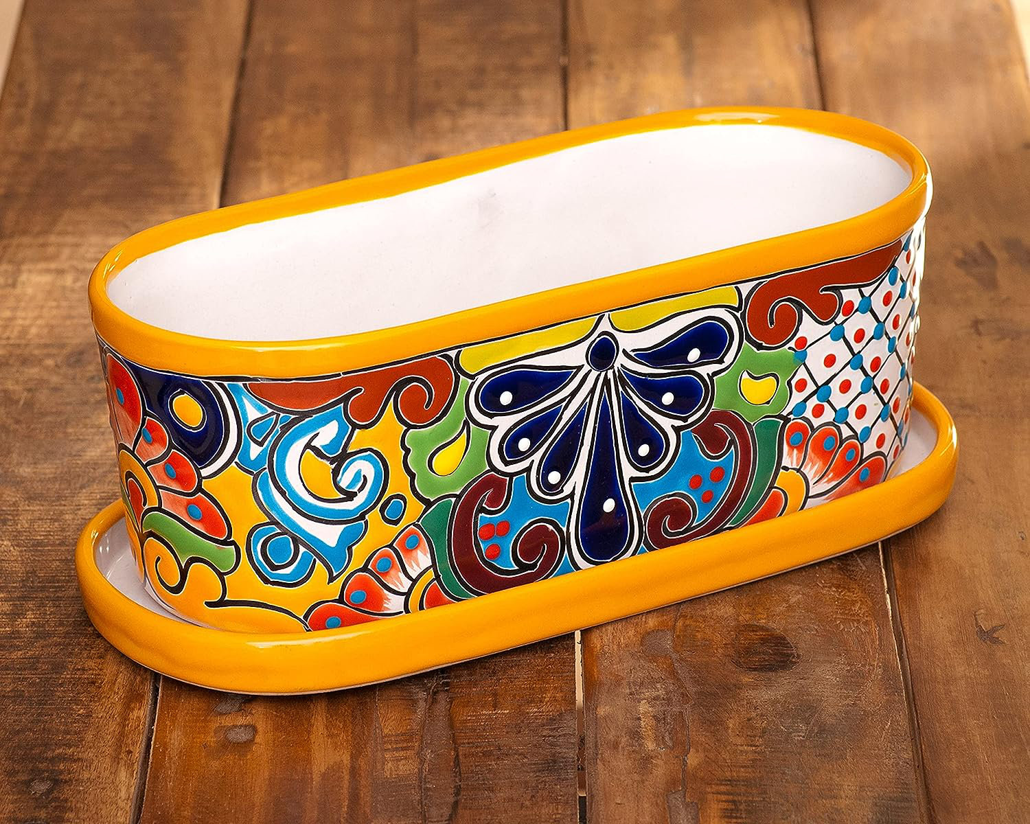 https://assets.wfcdn.com/im/78309175/compr-r85/2543/254318068/noeliz-handmade-mexican-talavera-colorful-flower-pot-succulent-planter-saucer-yellow-marigold.jpg