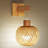 Anniek Rattan Swing Armed Sconce