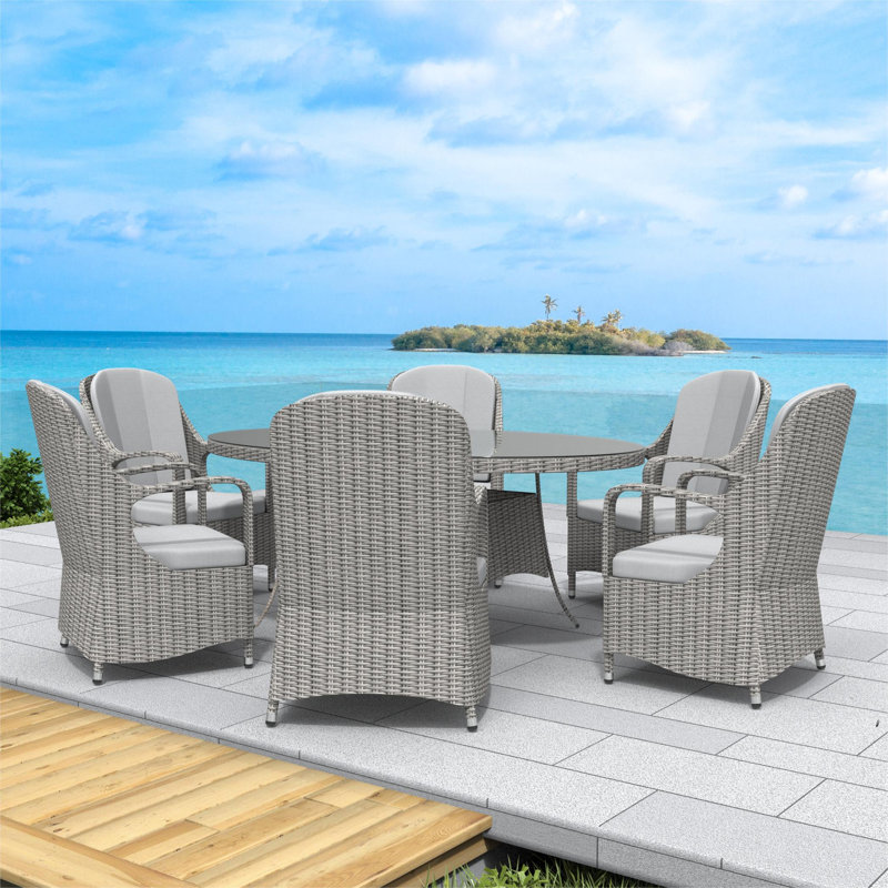 Dut 6 - Person Wicker Patio Dining Set with Oval Table , Cushions Included