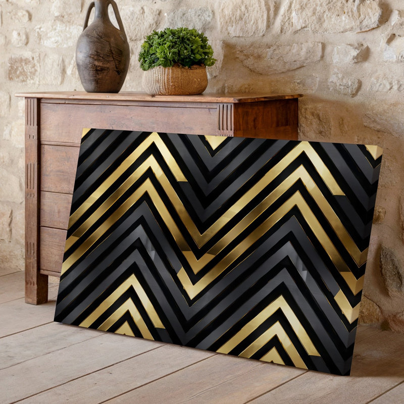Toile d'un motif géométrique sophistiqué avec des formes de chevrons audacieux dans un art mural frappant noir et doré