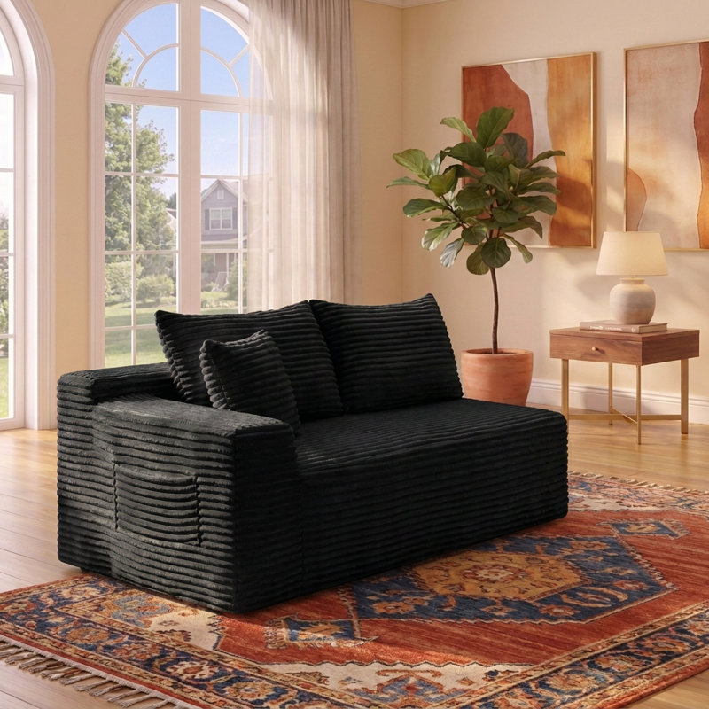 Canapé deux places compact sans accoudoirs, au ras du sol, avec revêtement moelleux, design modulaire moderne et discret.