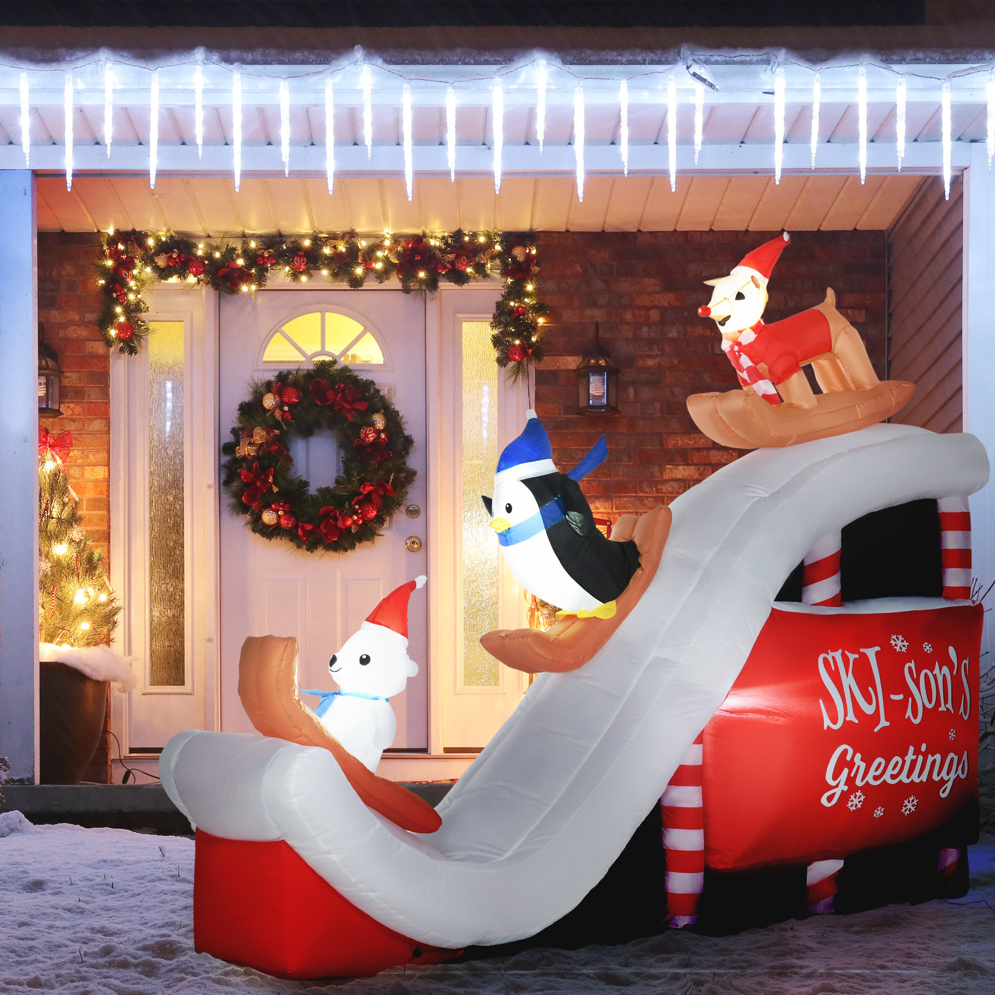 https://assets.wfcdn.com/im/78365946/compr-r85/2555/255521925/jadyne-polar-bear-penguin-and-reindeer-on-the-slope-inflatable.jpg