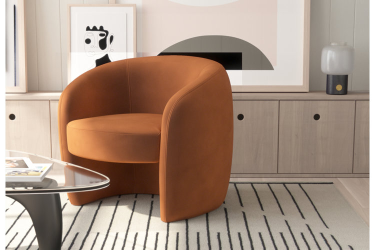 Living room space with orange lounge chair.