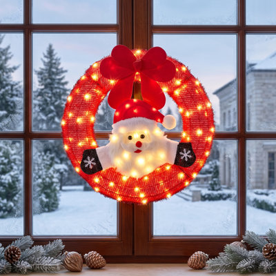 Couronne de Noël rouge de 24 pouces avec Père Noël ondulant et 100 lumières blanches chaudes pour les Fêtes