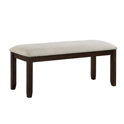 Banc en bois de cerisier foncé revêtu de chenille pour une décoration attrayante dans la salle à manger