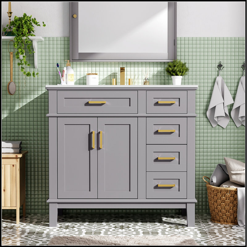 Meuble-lavabo moderne avec lavabo en céramique, portes à fermeture douce et tiroirs multiples pour les petites salles de bain organisées
