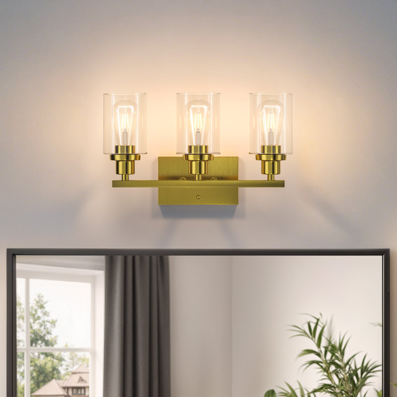 Éclairage pour salle de bain 3 lumières 19,5 po en or brossé avec abat-jour en verre transparent et contre-plaque rectangulaire