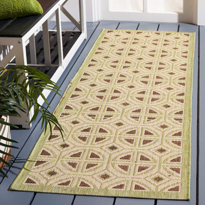 Tapis intérieur / extérieur vert / beige à motif géométrique Arneshia