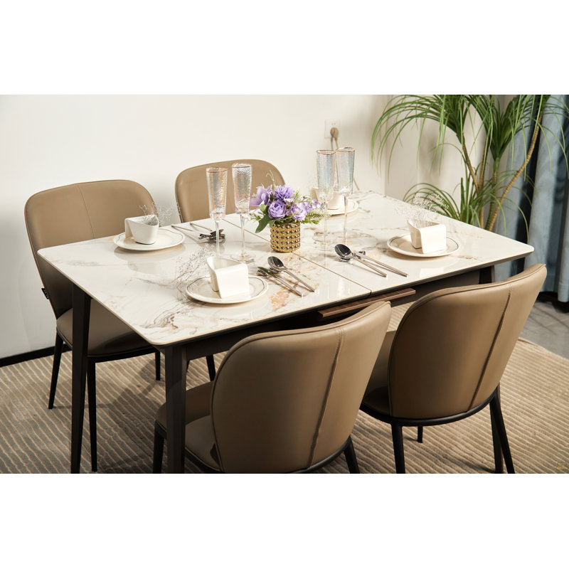 La plaque de roche peut être prolongée pour former une table à manger pour 6 à 8 personnes, une cuisine et un salon. Il peut être rapidement assemblé. Les matériaux sont la plaque de roche et la base en métal