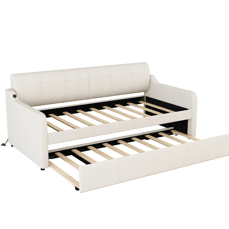 Lit de jour beige avec lit gigogne amovible et fonctionnalité de chargement