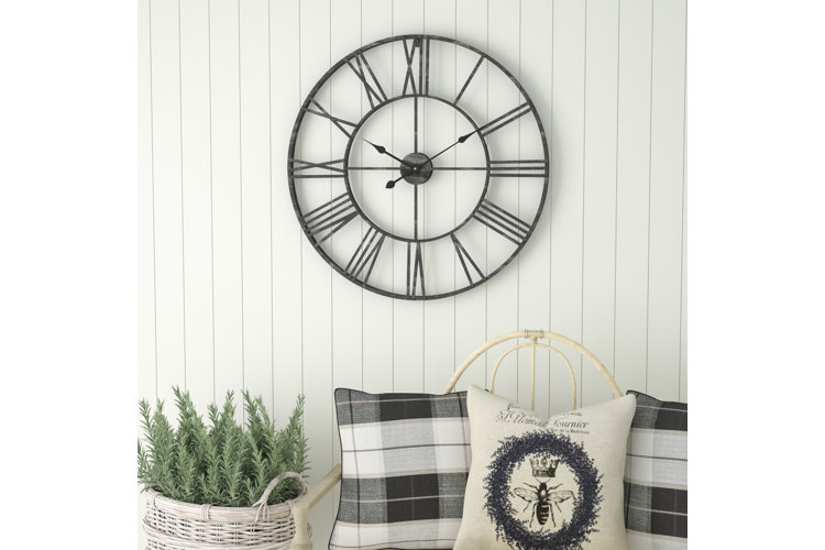 farmhouse style metal clock with roman numeral numbers
