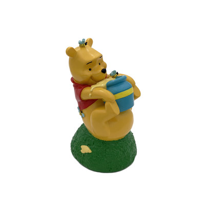 Statue de jardin Disney Winnie l'ourson roulant avec pot de miel
