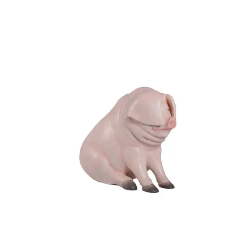 Statue de cochon assis assis