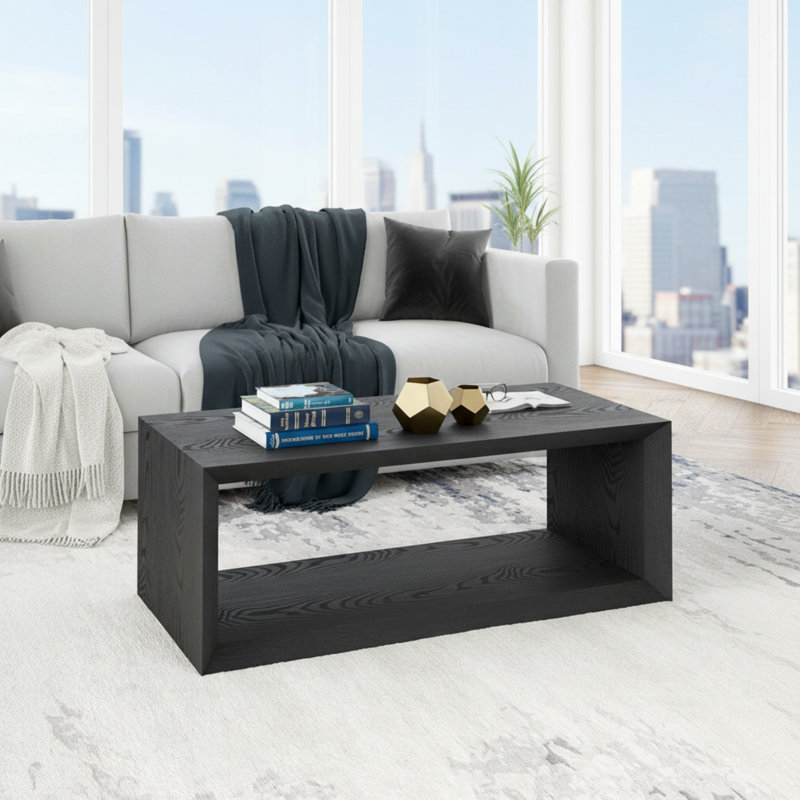 Table basse noire texturée, fabriquée en panneau de fibres à densité moyenne, facile à assembler.
