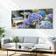 Tableau sur toile tendue représentant un jardin d'hortensias avec banc blanc et papillon (lot de 3)-475839022