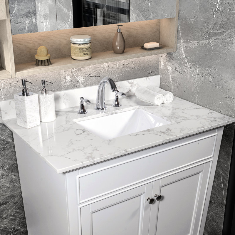 Le comptoir de meuble-lavabo en pierre blanche de 31 po avec lavabo et dosseret en céramique offre une option élégante.