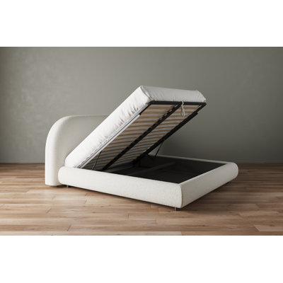 Modern upholstered storage bed in cream boucle fabric with lift-up storage and curved headboard