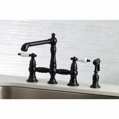 Kingston Brass English Country Two-Handle 4-Hole Deck Mount Bridge Kitchen Faucet with Brass Side Sprayer