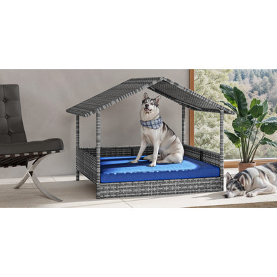 Niche en rotin tissé avec coussin et auvent