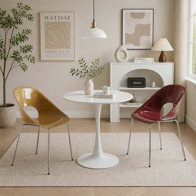 Table de salle à manger ronde blanche moderne avec un piètement robuste à une seule colonne, idéale pour les petits espaces de vie et les cuisines.