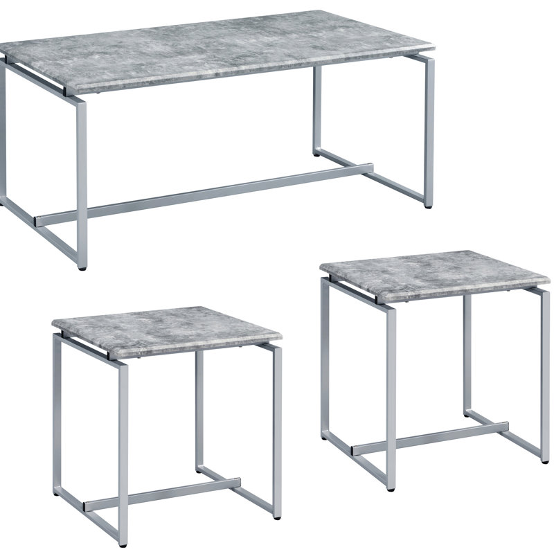 Tables d'appoint modernes grises et argentées - idéales pour le coin-détente. Surface rectangulaire en faux béton avec une base de traîneau en métal gris et une base de divertissement argentée.