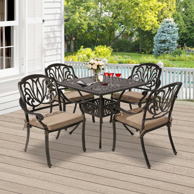 Aatish 4 - Person Patio Dining Set with Square Table , Cushions Included