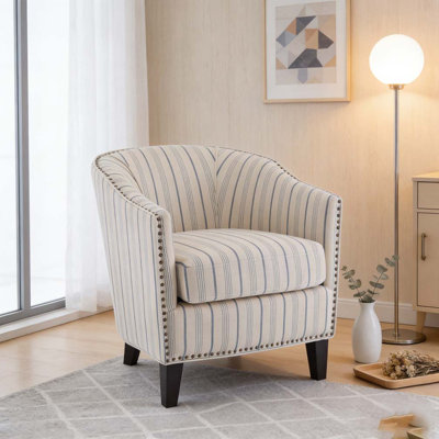 Fauteuil demi-tonneau rembourré à rayures