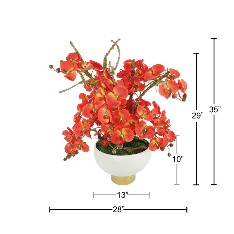 Arrangement de fausses orchidées modernes dans un vase en céramique