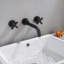 Robinet de lavabo de salle de bain mural en laiton massif noir mat avec deux poignées en croix