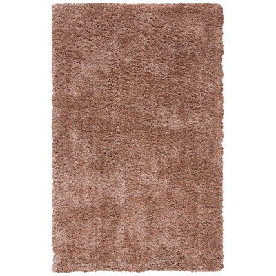 Tapis brun touffeté à la main