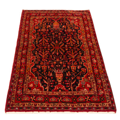 Splendid piece of work that is woven in Turkey with a re-interpretation of village Persian designs. The vintage and distressed look make this hand-knotted wool rug a natural standout.