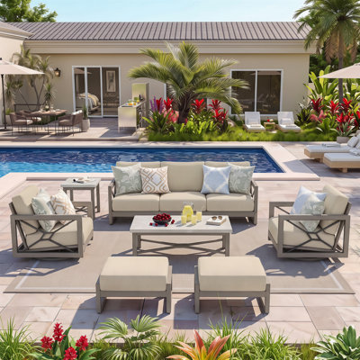 Patio Swivel Aluminum Conversation set with Ottomans, Sunbrella Cushions and Concrete Tables for 5 Person