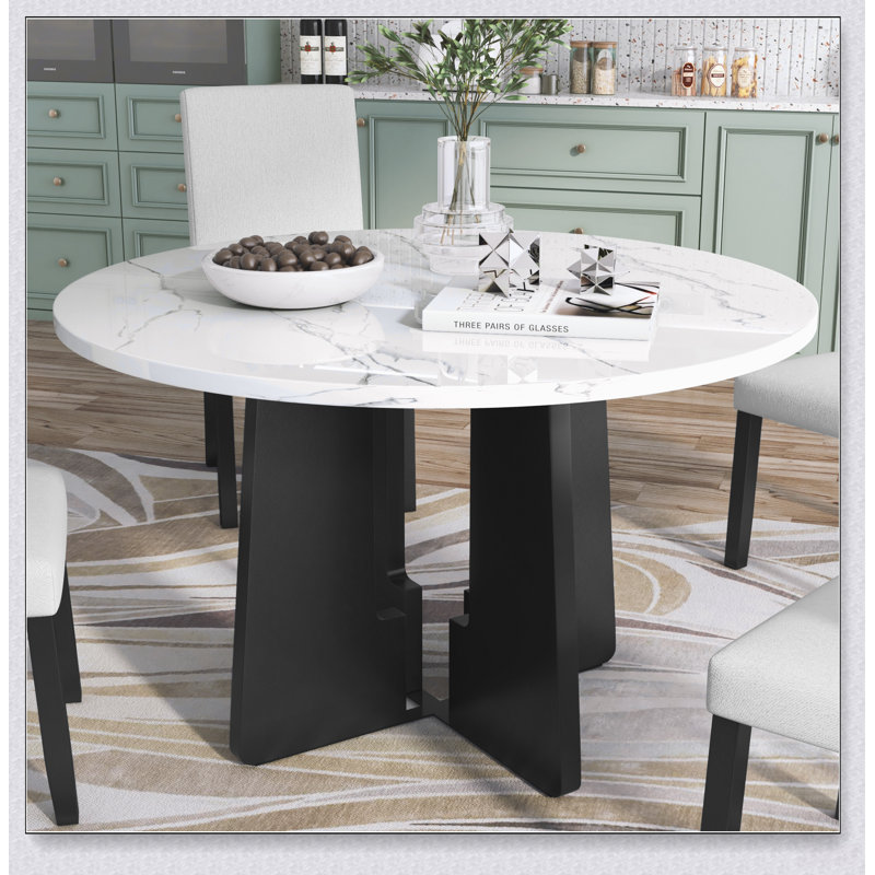 Table de salle à manger ronde en faux marbre pour quatre personnes, avec une surface résistante et un design moderne et polyvalent pour un usage domestique.