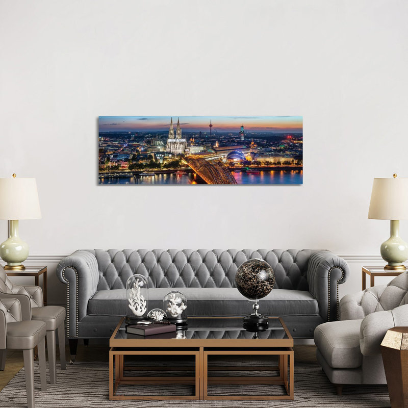 Aerial View Of Cologne With Cologne Cathedral And Hohenzollern Bridge At Night by Jan Becke - Wrapped Canvas Panoramic Print