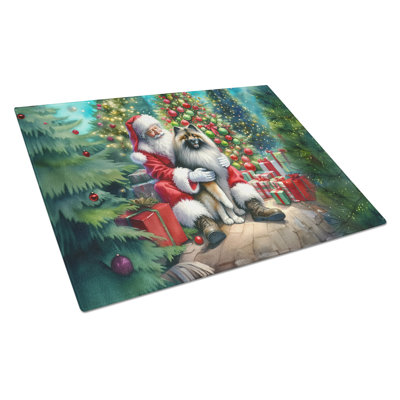 Keeshond and Santa Claus Glass Cutting Board