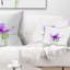 Coussin décoratif imprimé floral mauve avec éclaboussures vertes
