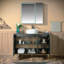 Meuble-lavabo moderne de 48 po avec lavabos vasques ronds en céramique et plateau en pierre reconstituée noire, finition laquée noir mat et accents dorés WOODBRIDGE, conception de cadre mince et profil épuré.