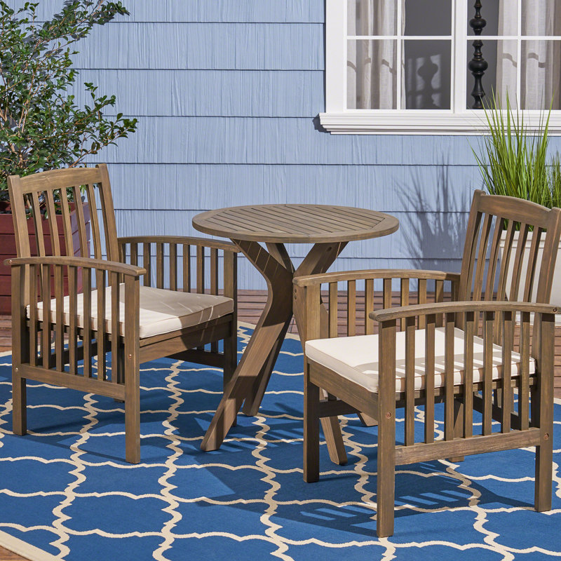 Tinnin 2 - Person Acacia Solid Wood Patio Dining Set Round Table with Cushions Included, Cream