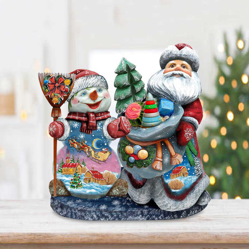 Figurine chef-d'œuvre de père Noël sculpté sur bois avec bonhomme de neige