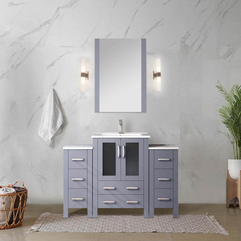 Meuble-lavabo simple avec armoires latérales, comptoir en céramique et miroir
