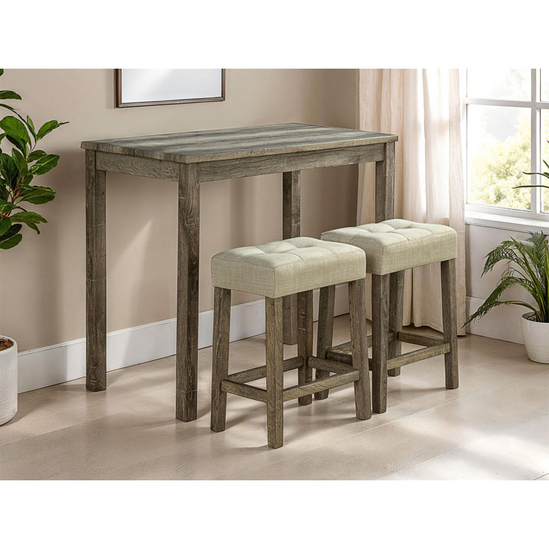 Ensemble de salle à manger moderne 3 pièces avec tabourets capitonnés et table compacte à hauteur de comptoir pour petits espaces.