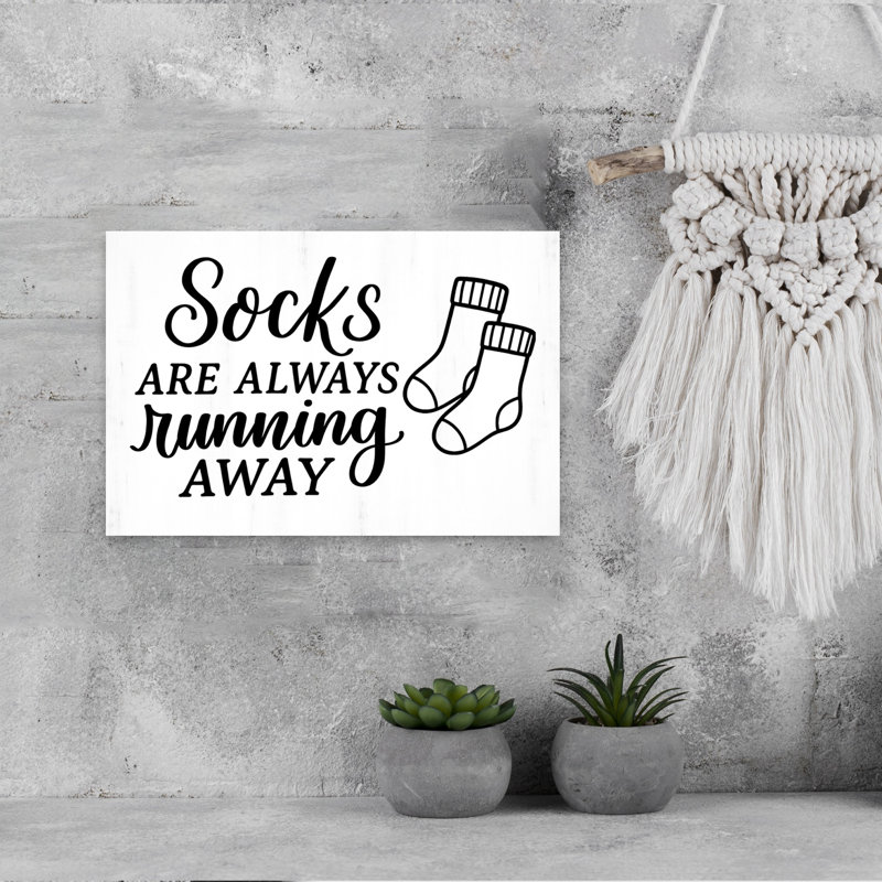 Socks Running Away by Imperfect Dust - Wrapped Canvas Print, 30.48cm H x 45.72cm W