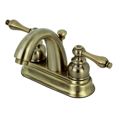 Kingston Brass Restoration Two-Handle 3-Hole Deck Mount 4" Centerset Bathroom Faucet with Plastic Pop-Up