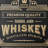 Winston Porter Barrel Aged Whiskey Embossed Black and Gold Metal Bar Sign