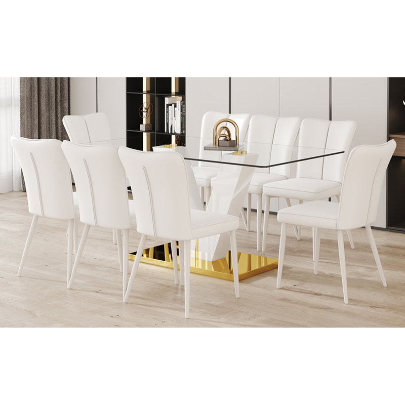 Ensemble de table de salle à manger en verre trempé transparent Subtle Luxury - 71 po x 35,4 po avec 8 chaises de style crème avec dossier à lignes verticales, parfait pour créer une atmosphère chaleureuse et invitante