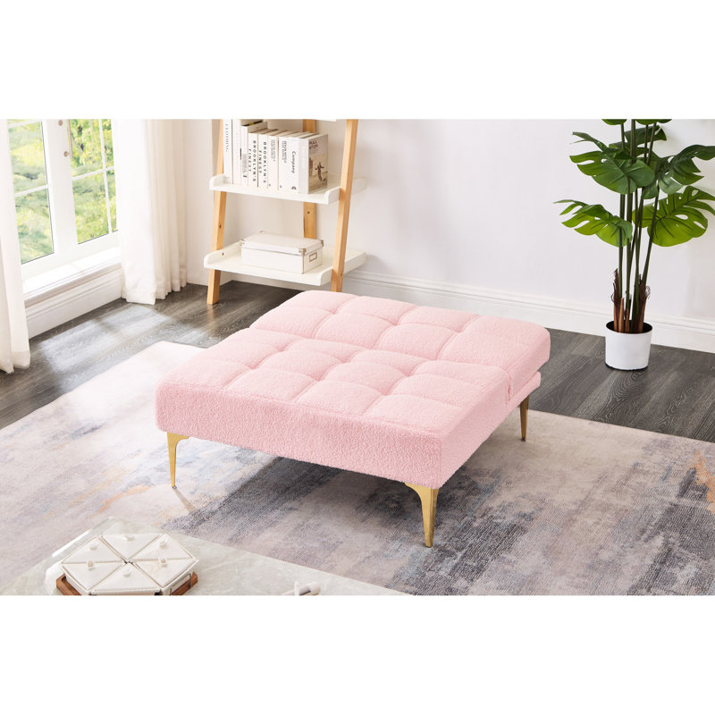 Futon convertible avec tissu rose et pieds en métal dorés - Confortable pour les petits espaces tout en polyvalence