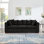 Canapé de salon moderne et élégant avec accoudoirs carrés et décoration cloutée, revêtu de velours pour le confort et l'élégance