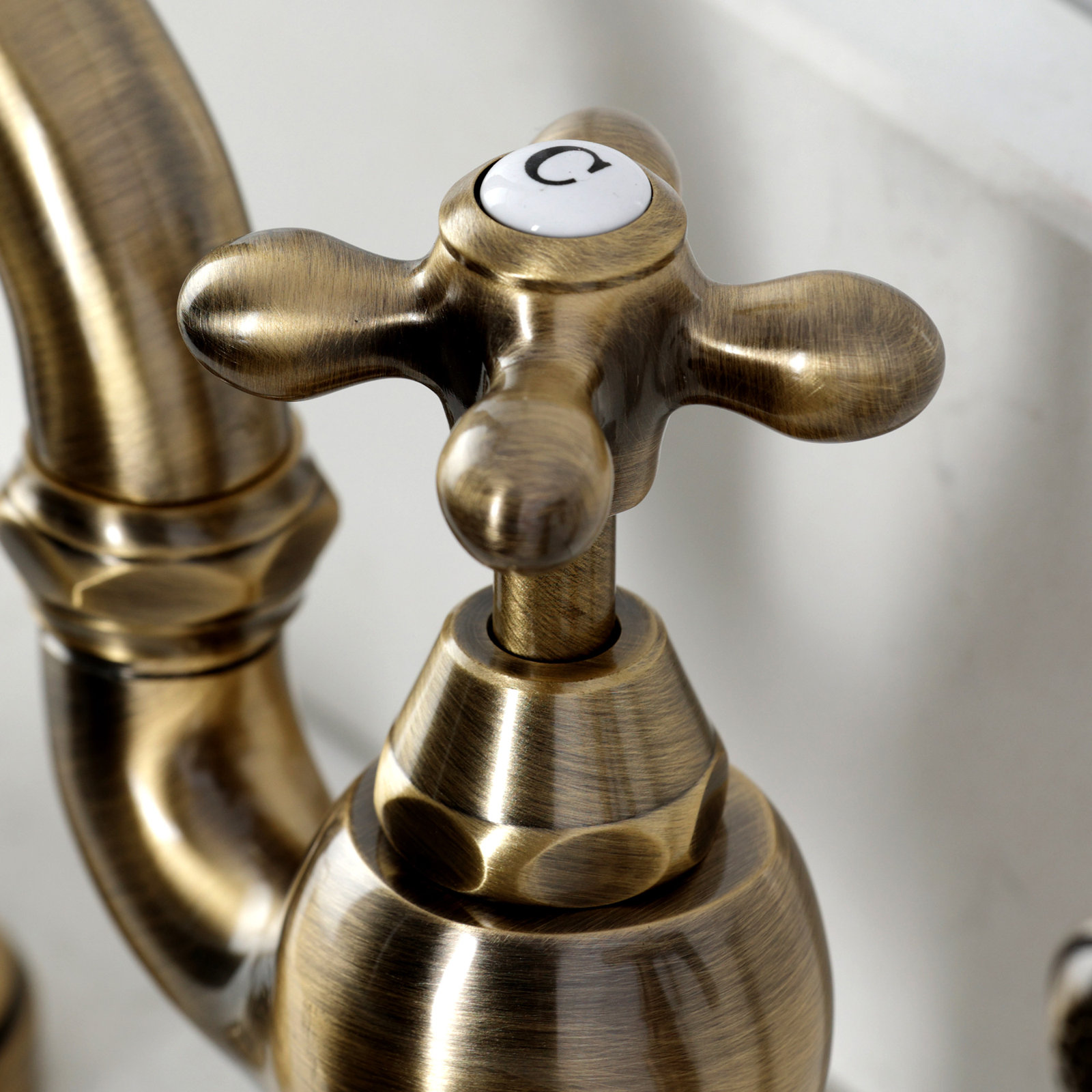 Kingston Brass English Country Two-Handle 3-Hole Deck Mount Bridge Kitchen Faucet with Side Sprayer, Antique Brass