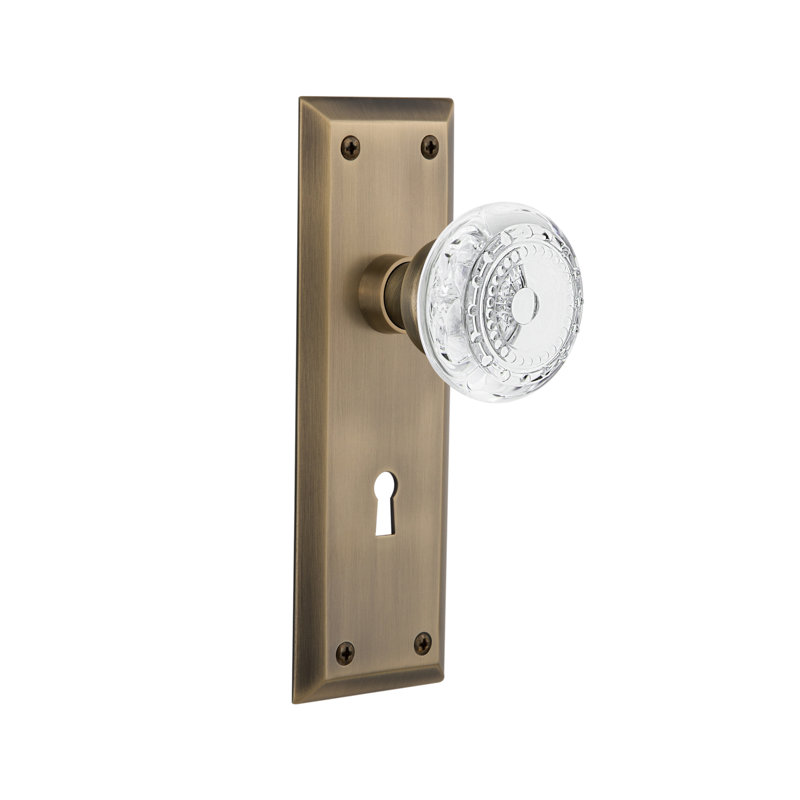 Crystal Meadows Interior Mortise Door Knob with New York Long Plate, Antique Brass